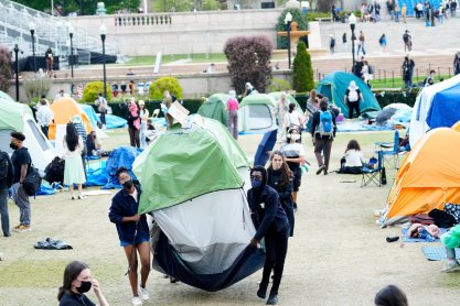 People move the first aid tent from one side of the encampment to another, on the campus of Columbia University, Wednesday, April 24, 2024, in New York City.