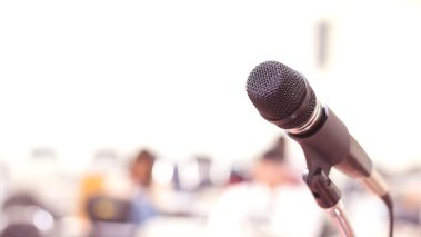 Microphone in conference on seminar room event background