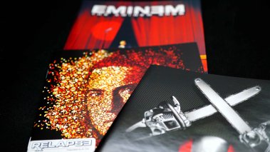 Covers of CDs by American rapper songwriter record producer EMINEM