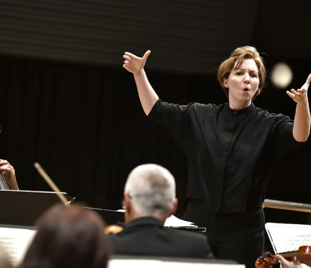 Rebecca Bryant Novak conducting an orchestra