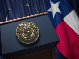 Press conference state of Texas Seal with Texas state flag in background