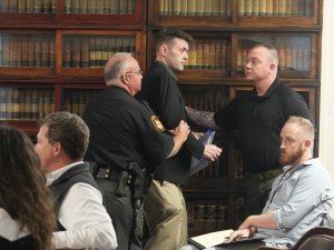 Derek Myers escorted out of court
