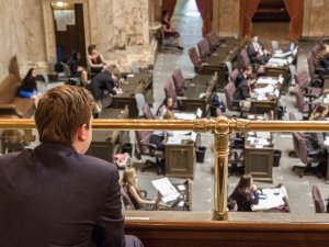 Lawmakers at their desks in the Washington state capitol in Olympia 