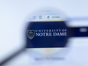 University of Notre Dame website logo under magnifying glass
