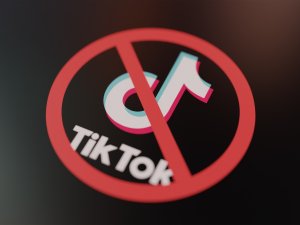 TikTok logo crossed out with red Ban sign 