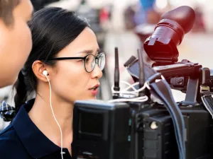 Student journalist filming on campus