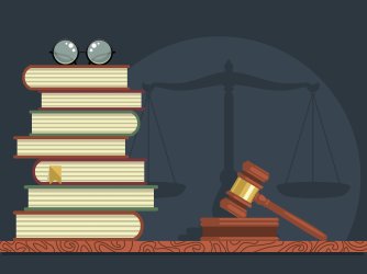 Stack of books with glasses and judge gavel 