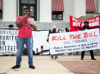 Protestor in Tampa Bay speak during a protest in front of the Florida Historic Capitol 