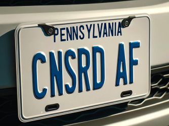 Pennsylvania license plate reading, "CNSRD AF"