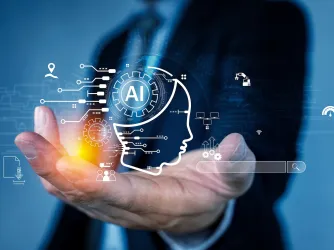 Human hand holding AI artificial intelligence virtual assistant chatbot concept