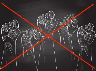 Protest fists drawn on black chalkboard with a red strike crossing them out.