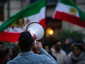 Protester against Iran regime holding a bullhorn