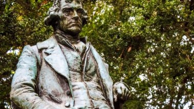 UVA campus statue of Thomas Jefferson, visibly displeased that the university he founded is ignoring the First Amendment he helped shape.