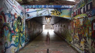 This is the free expression tunnel located on the North Carolina State University campus. It is a tunnel where students and non-students are able to graffi freely what they want to express.