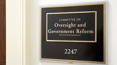 A sign at the entrance to a House Oversight Committee hearing room in Washington, The House of Representatives is the lower chamber of the US Congress.