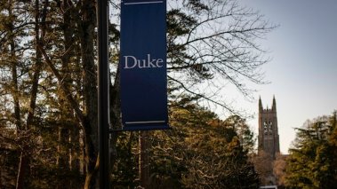 Duke University banner with admissions building in background.