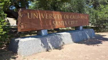 Wooden entrance sign at the base of the University of California, Santa Cruz campus on June 15, 2016 in Santa Cruz, California.