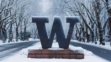 University of Washington welcome sign under snow