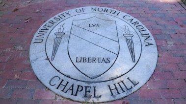 Chapel Hill, NC / USA - October 21, 2020: The University of North Carolina Chapel Hill Seal in brick walk way.