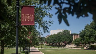 Texas State University banner and campus