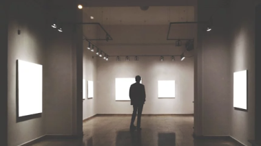 person stands alone in an empty room