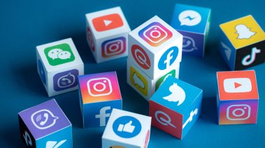 paper cubes collection with printed logos of world-famous social networks and online messengers, such as Facebook Instagram YouTube Telegram