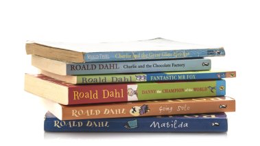 Pile of old Roald Dahl books on a white background