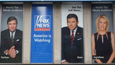 Fox News advertisement featuring Tucker Carlson Brett Baier and Laura Ingraham CREDIT Leonard Zhukovsky Shutterstock