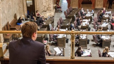 Lawmakers at their desks in the Washington state capitol in Olympia 