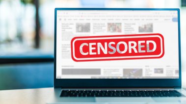 Laptop computer displaying the sign of censorship on an internet news site