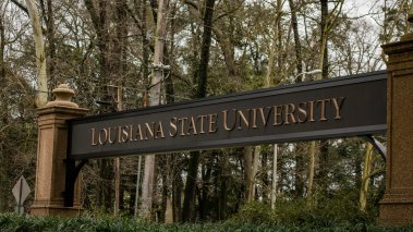 Louisiana Statue University campus welcome banner