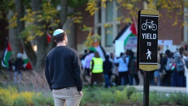 A Jewish man watches as demonstrators march on campus at Purdue University in West Lafayette