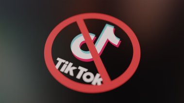 TikTok logo crossed out with red Ban sign 