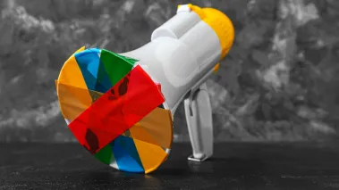 Taped megaphone on dark table