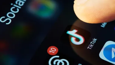 Person opening TikTok on their phone