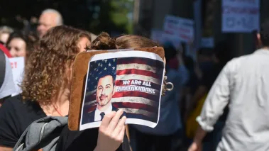 Protesters with a sign that reads, "We are all Jimmy Kimmel"