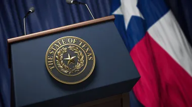 Press conference state of Texas Seal with Texas state flag in background
