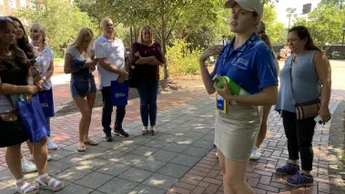 A guide leads college prospective students on a tour of the University of Delaware in Newark