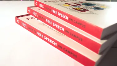 Guide to Free Speech on Campus books stacked with shadows