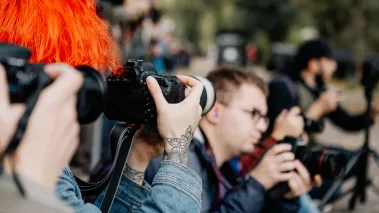Student journalist taking a photograph