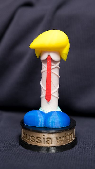 Dildo wearing a toupee in the style of Donald Trump