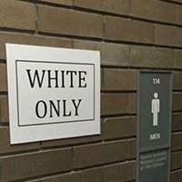 "White Only" sign for public restroom - Credit: Micah Oliver / The Spectrum