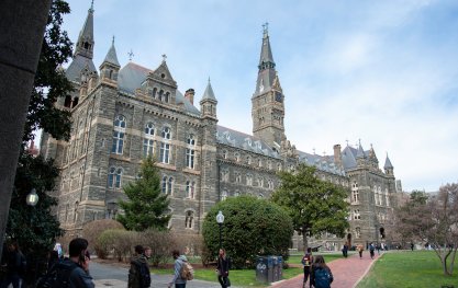 Students walk near Healy Hall at Georgetown University.