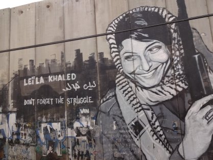 Bethlehem wall with graffiti depicting Leila Khaled.
