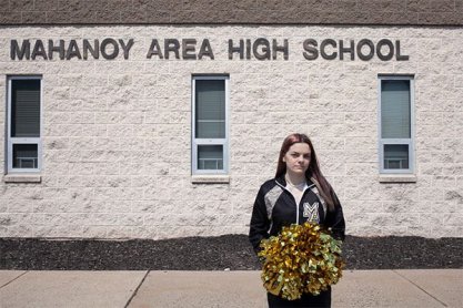 Brandi Levy in front of Mahanoy Area High School