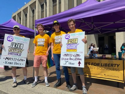Students at University of Washington hold up pro-speech signs