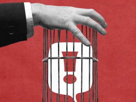 Hand putting exclamation mark in a cage