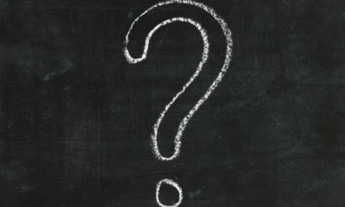 large question mark in chalk on a blackboard