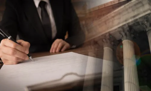 lawyer signing legal document