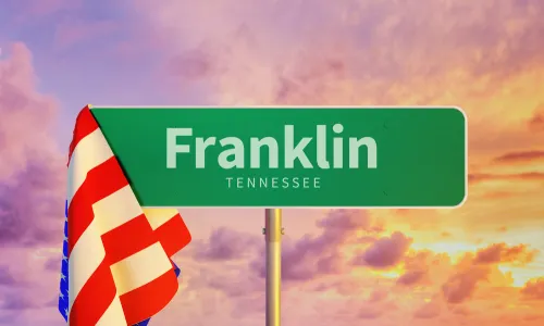 Franklin Tennessee road sign draped with American flag